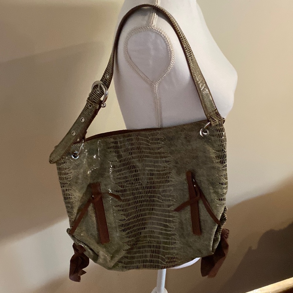 Chez purse of animal print with solid tan leather accents.
